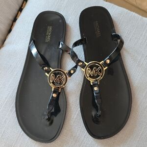 Michael Kors Black Patent Jelly Sandals with Gold MK Emblem